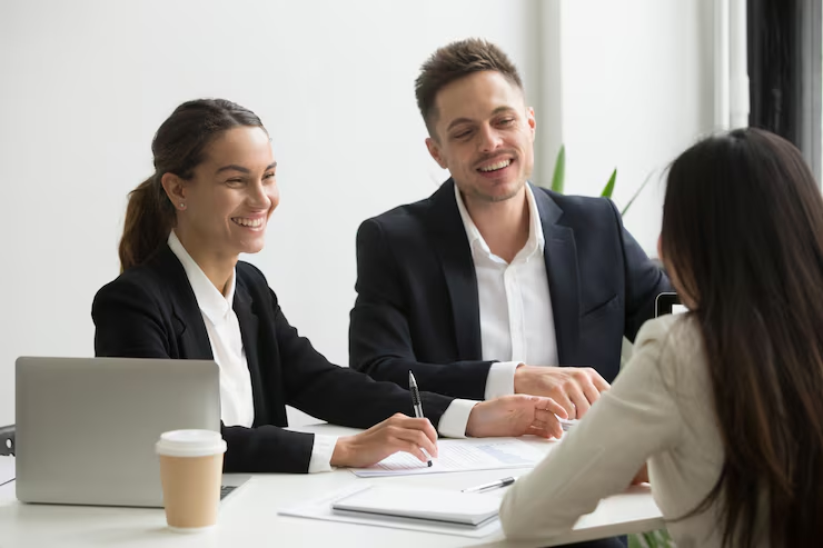 friendly-team-members-chatting-laughing-together-office-break